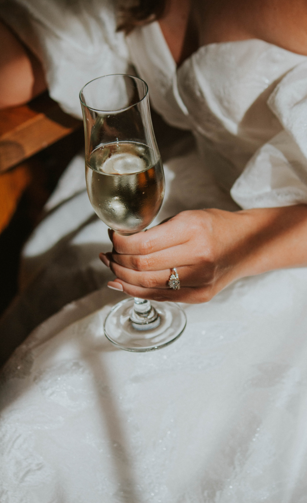 Bride holding champagne flute
