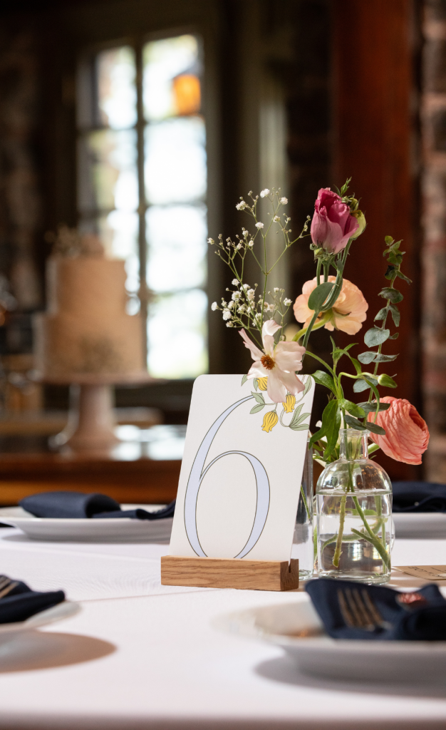 Floral centerpiece and table number for wedding reception