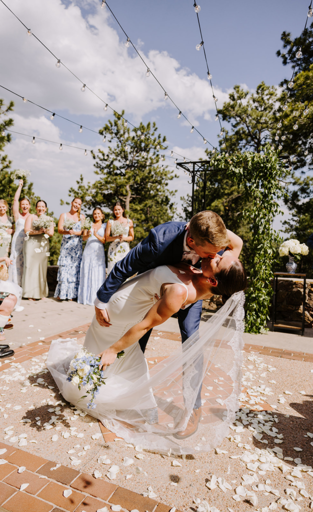 Bride and groom kissing after wedding ceremony